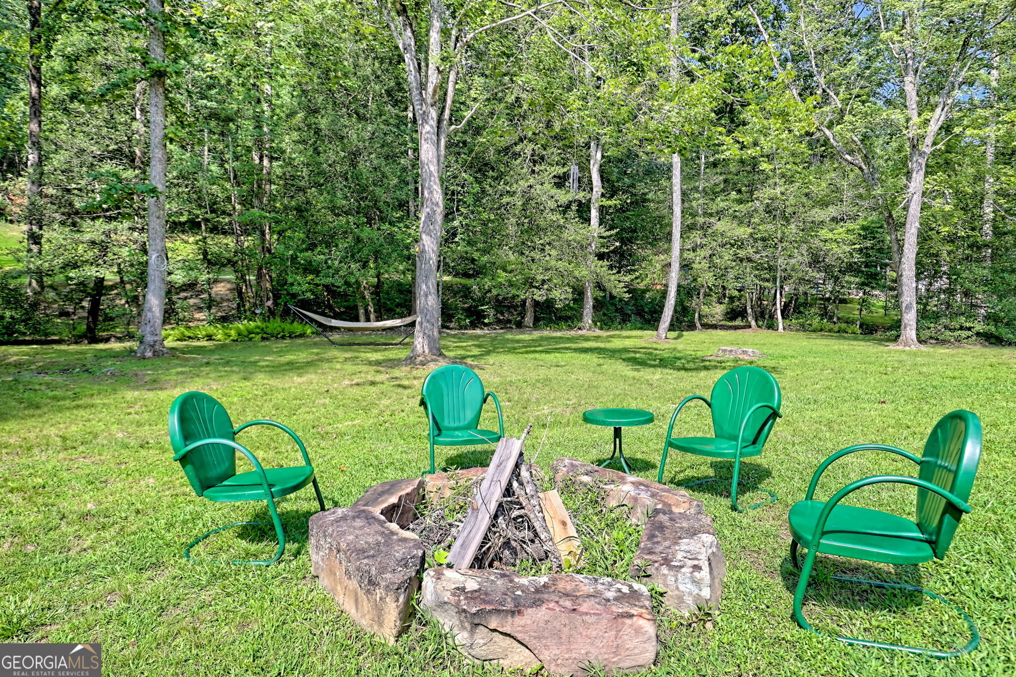 4960 Laurel Lodge Road, Unit 18 Clarkesville, GA 30523 - Photo 53 of 59 a view of a table and chairs in the garden
