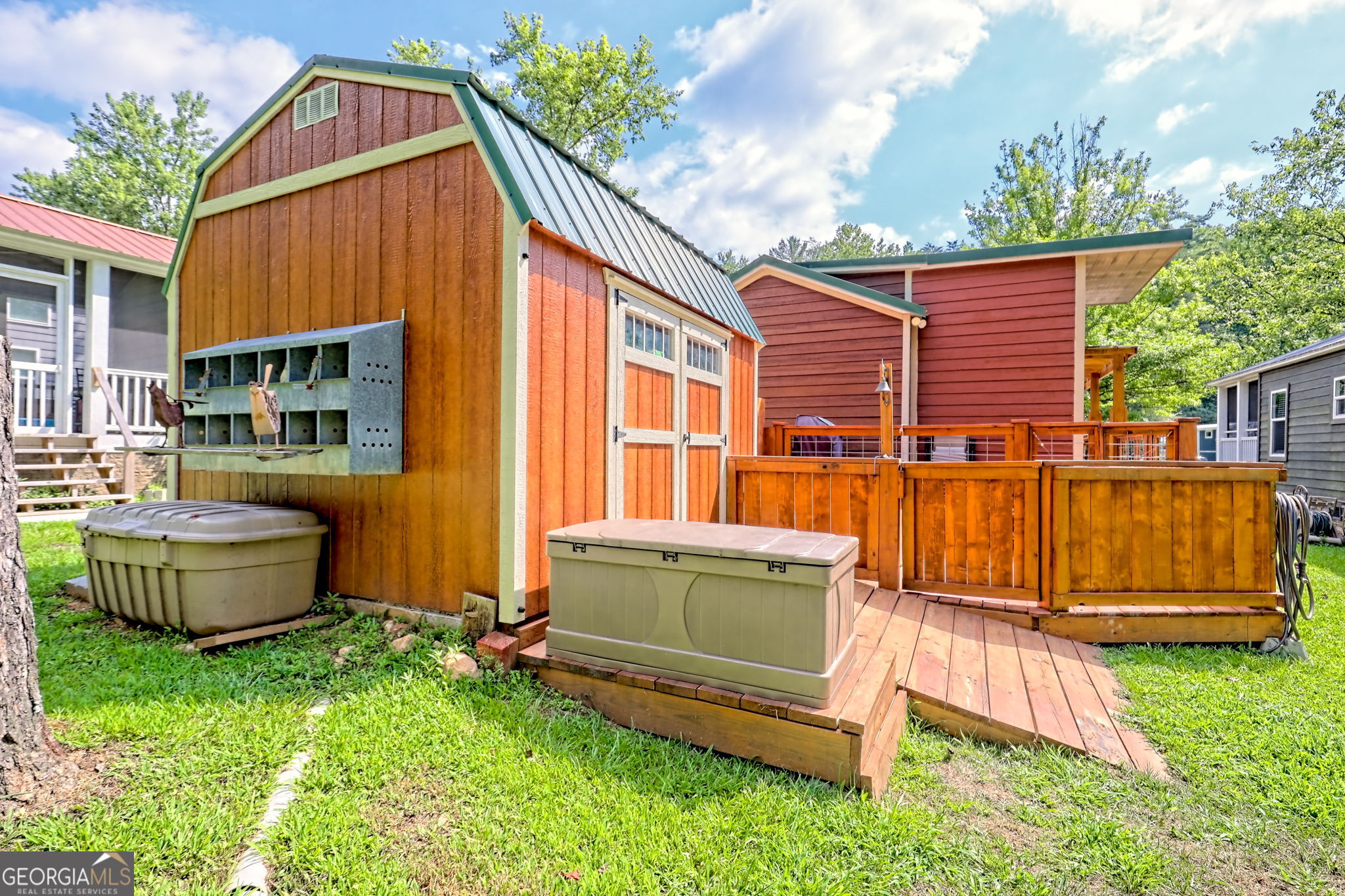 4960 Laurel Lodge Road, Unit 18 Clarkesville, GA 30523 - Photo 55 of 59 a view of a house with backyard and sitting area