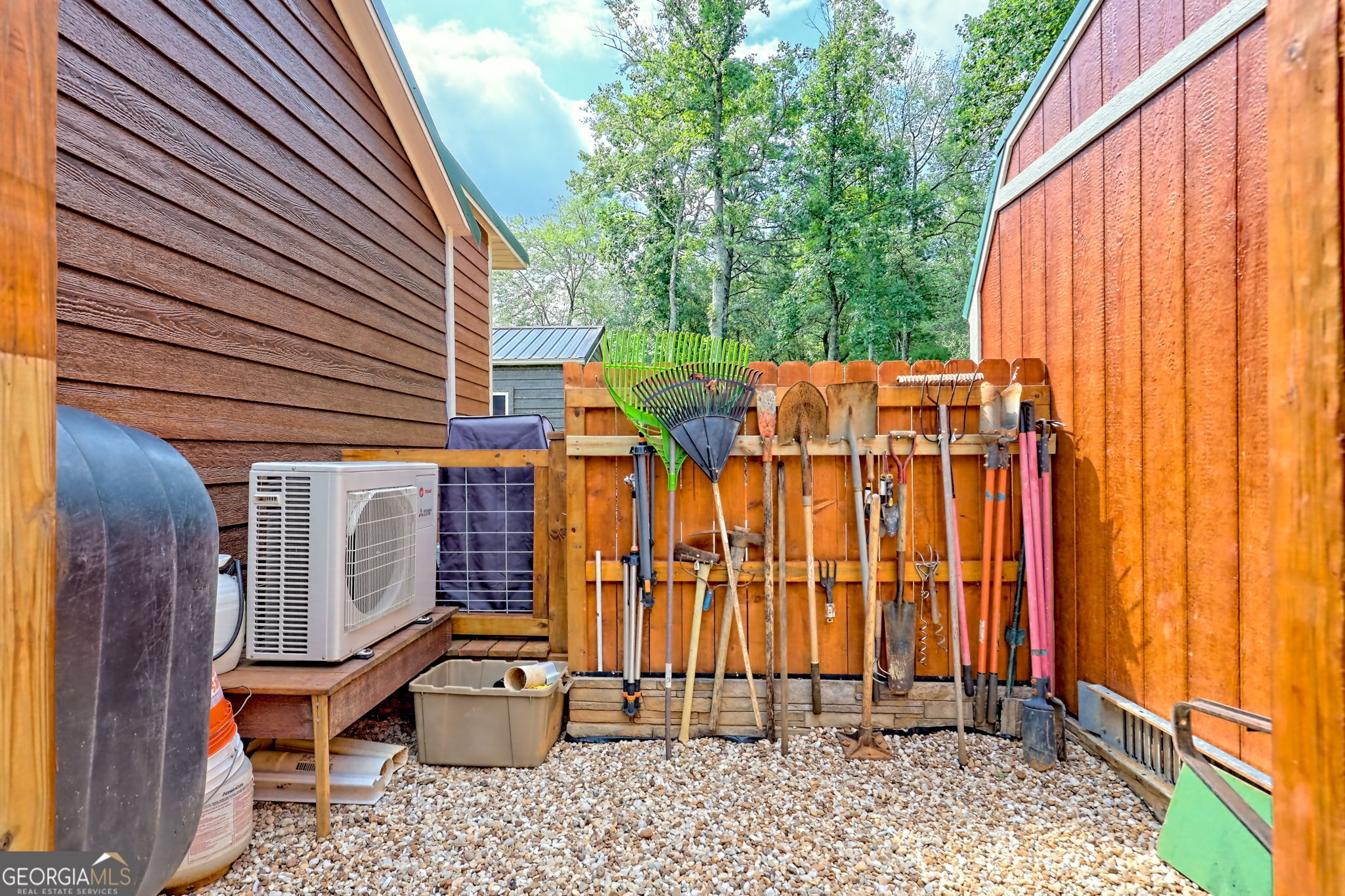 4960 Laurel Lodge Road, Unit 18 Clarkesville, GA 30523 - Photo 58 of 59 a view of a patio with a table and chairs and potted plants