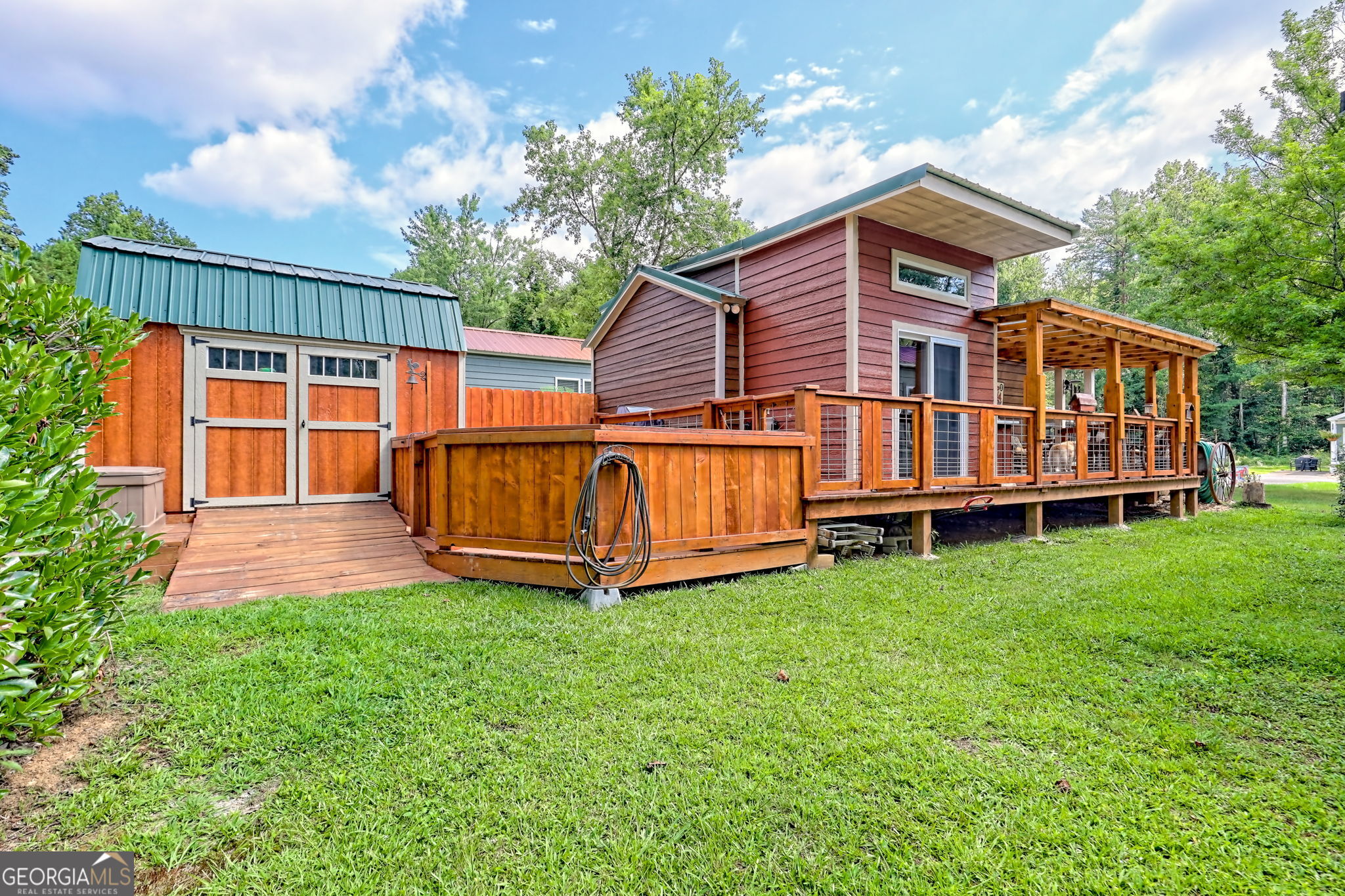 4960 Laurel Lodge Road, Unit 18 Clarkesville, GA 30523 - Photo 59 of 59 a view of a house with a yard and deck