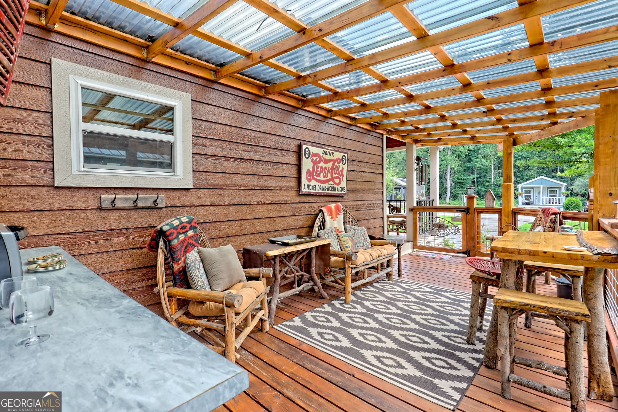 4960 Laurel Lodge Road, Unit 18 Clarkesville, GA 30523 - Photo 7 of 59 a view of a patio with table and chairs