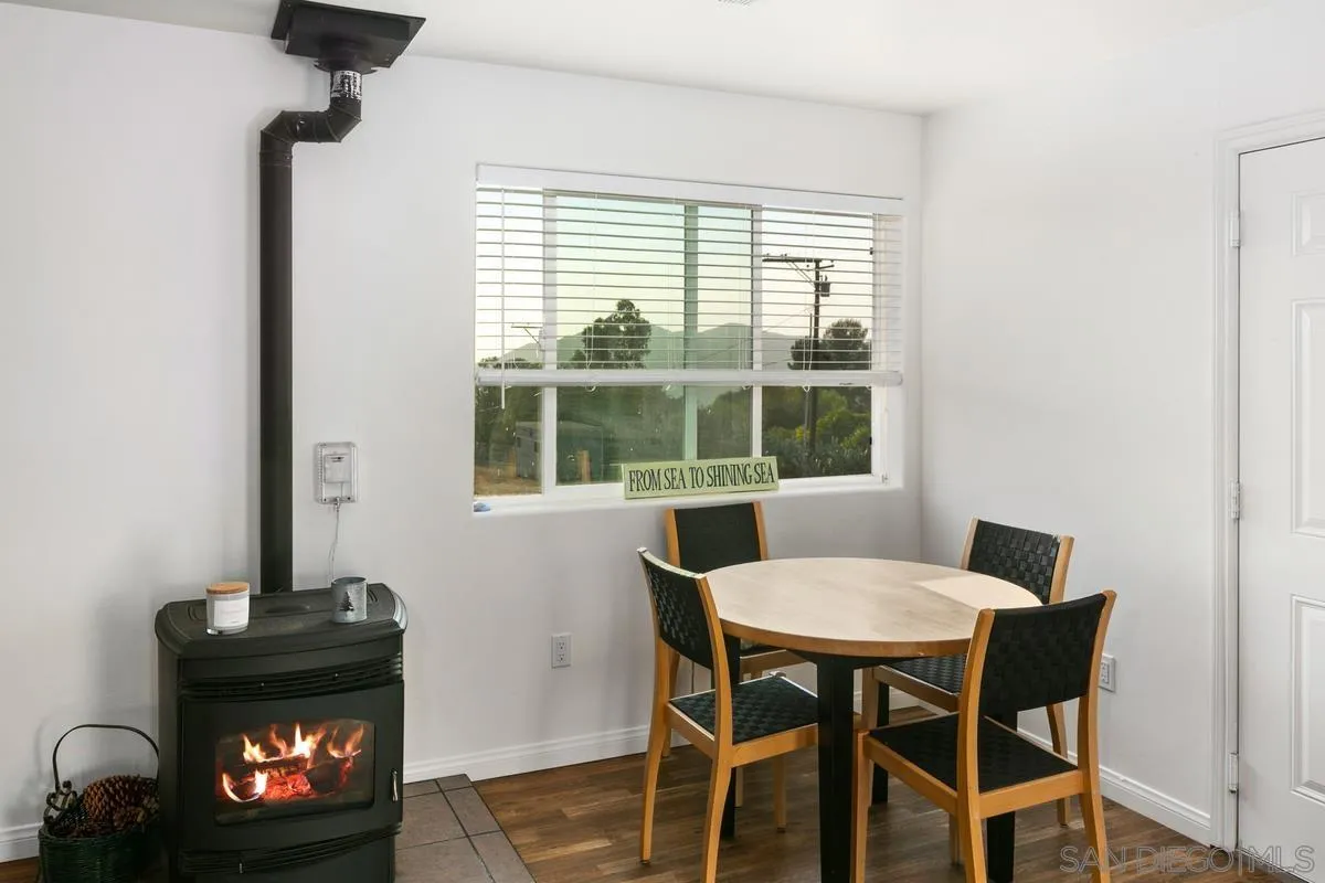 738 Lilac Ranch Road Alpine, CA 91901 - Photo 34 of 72 a view of a dining room with a table and chairs