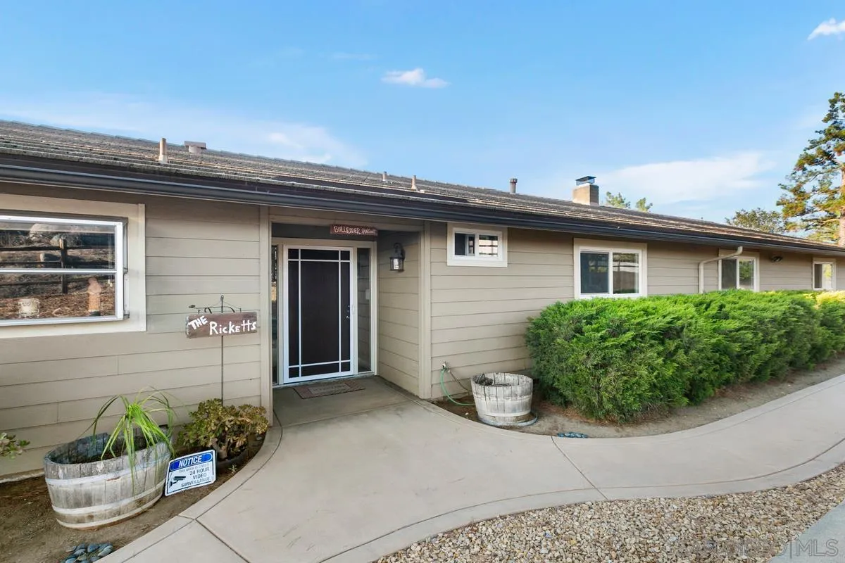 738 Lilac Ranch Road Alpine, CA 91901 - Photo 4 of 72 a front view of a house with a yard