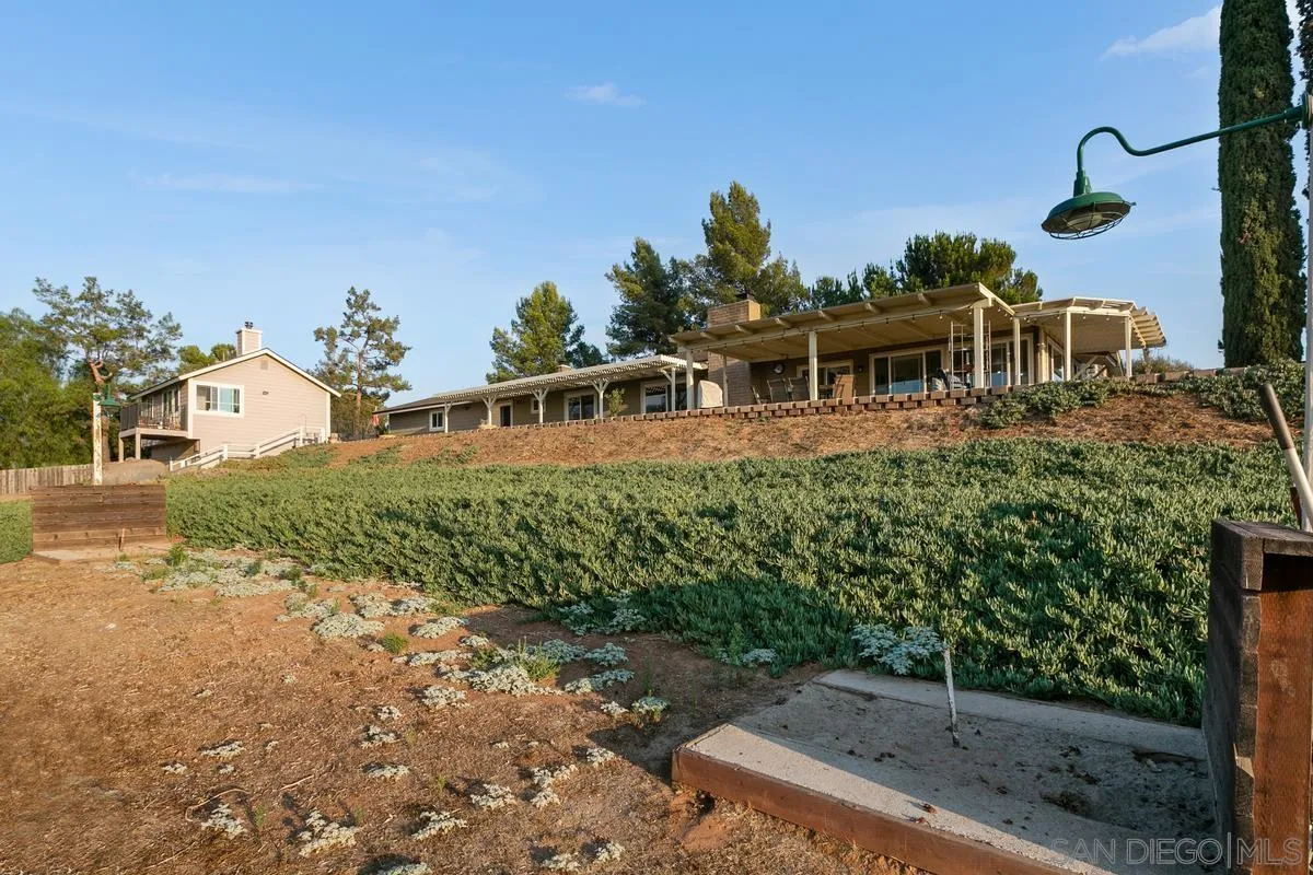 738 Lilac Ranch Road Alpine, CA 91901 - Photo 54 of 72 a front view of a house with a yard