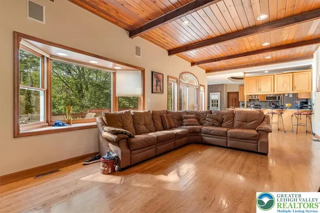 a kitchen with stainless steel appliances granite countertop a sink a stove and cabinets