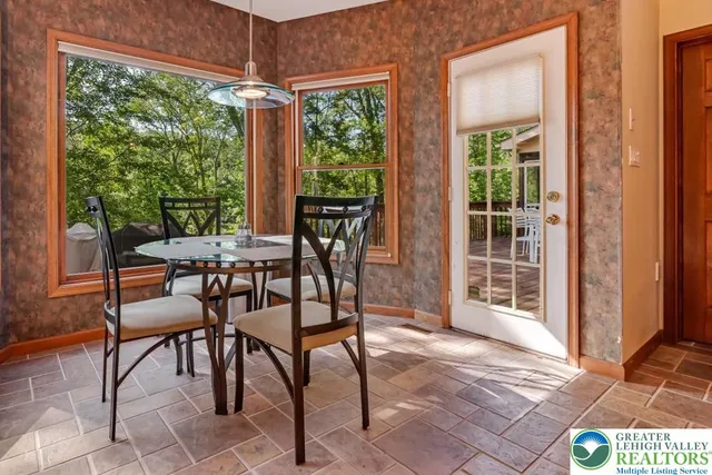 a view of an entryway with wooden floor