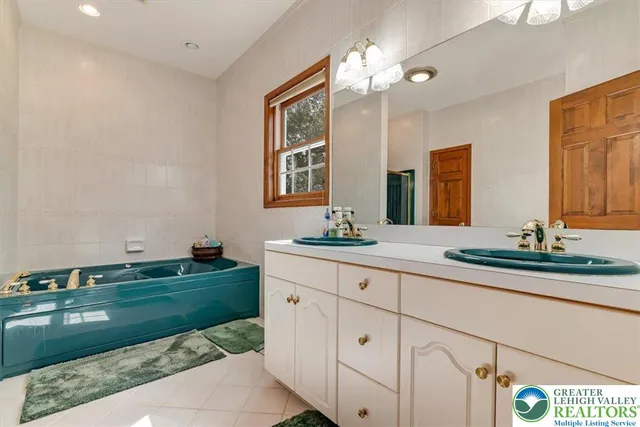 a room with a refrigerator and a wooden floor