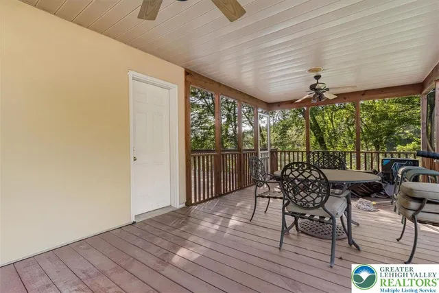 a view of a house with backyard and porch