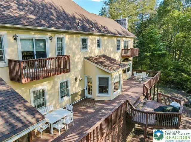 an aerial view of a house swimming pool and outdoor space