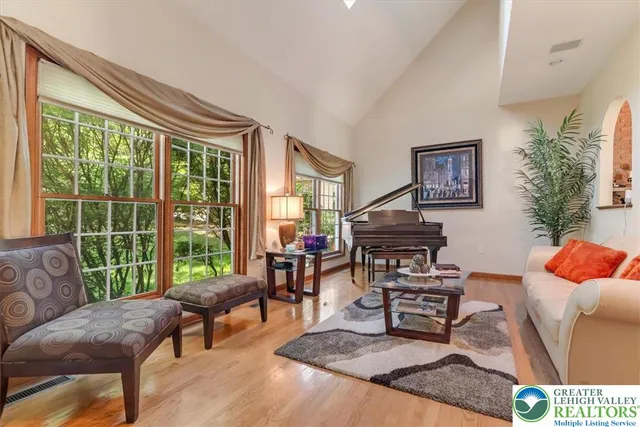 a living room with furniture and a large window