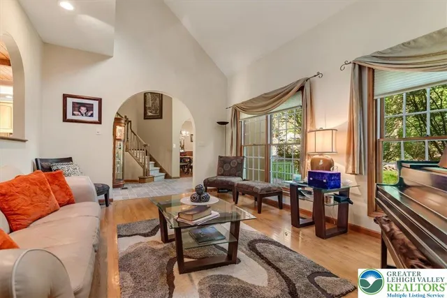 a view of a dining room with furniture and chandelier