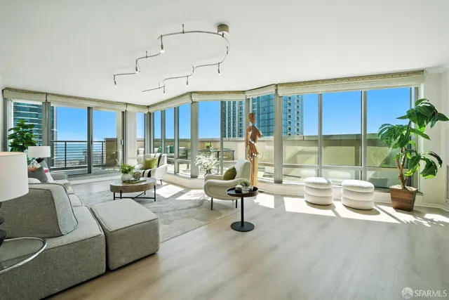 a living room with furniture or outdoor area and a large window