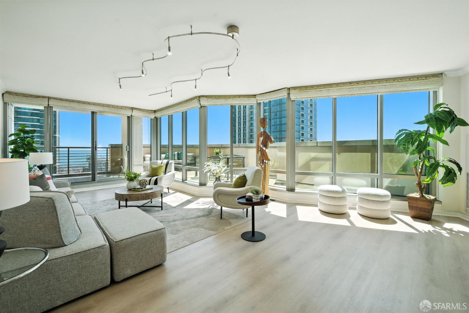 a living room with furniture or outdoor area and a large window