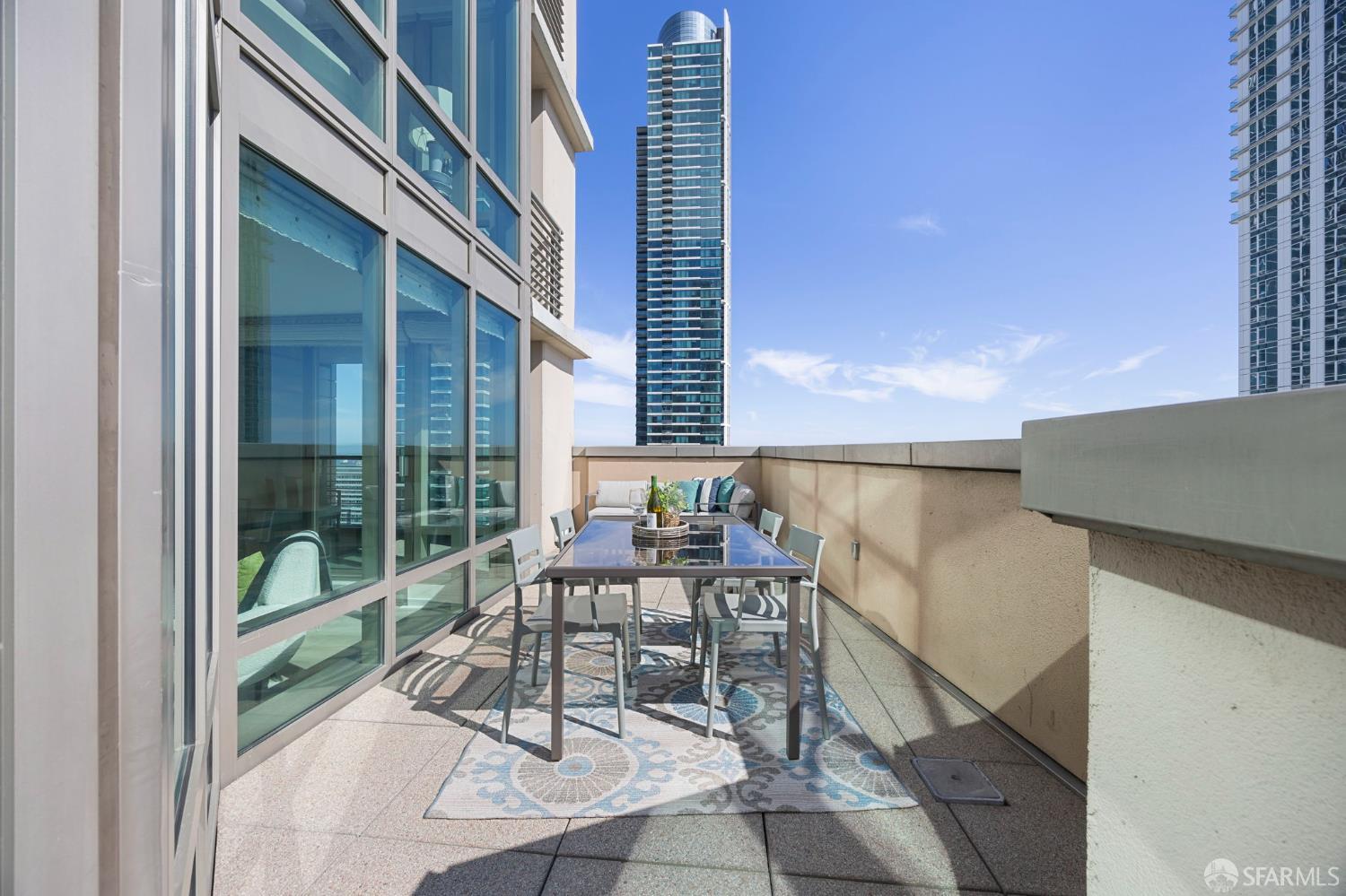 355 1st Street, Unit S2503 San Francisco, CA 94105 - Photo 16 of 67 a patio with table and chairs