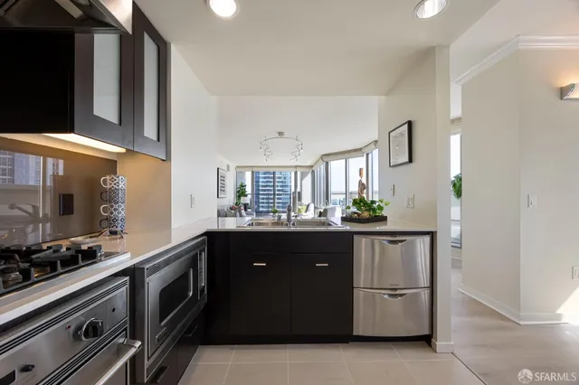 a view of a hallway with couches and a rug floor