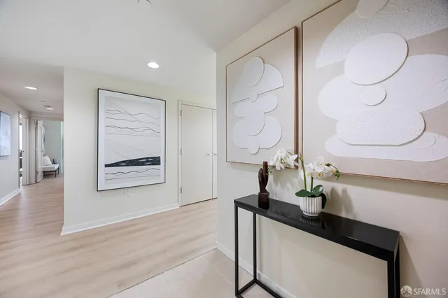 a bedroom with bed and a potted plant