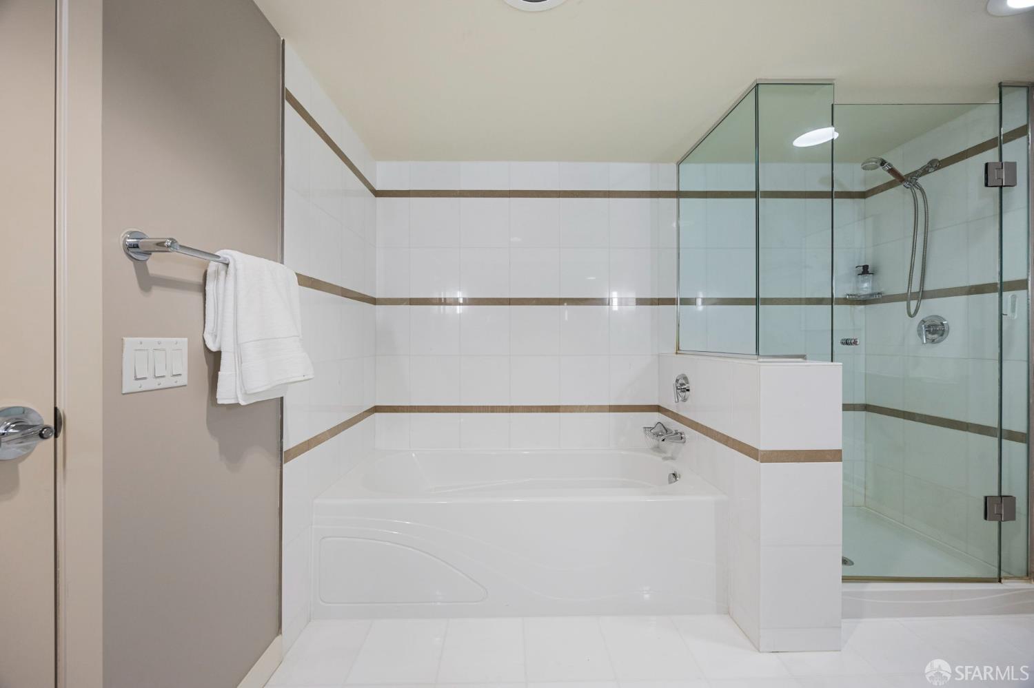 355 1st Street, Unit S2503 San Francisco, CA 94105 - Photo 28 of 67 a bathroom with a bathtub and a shower