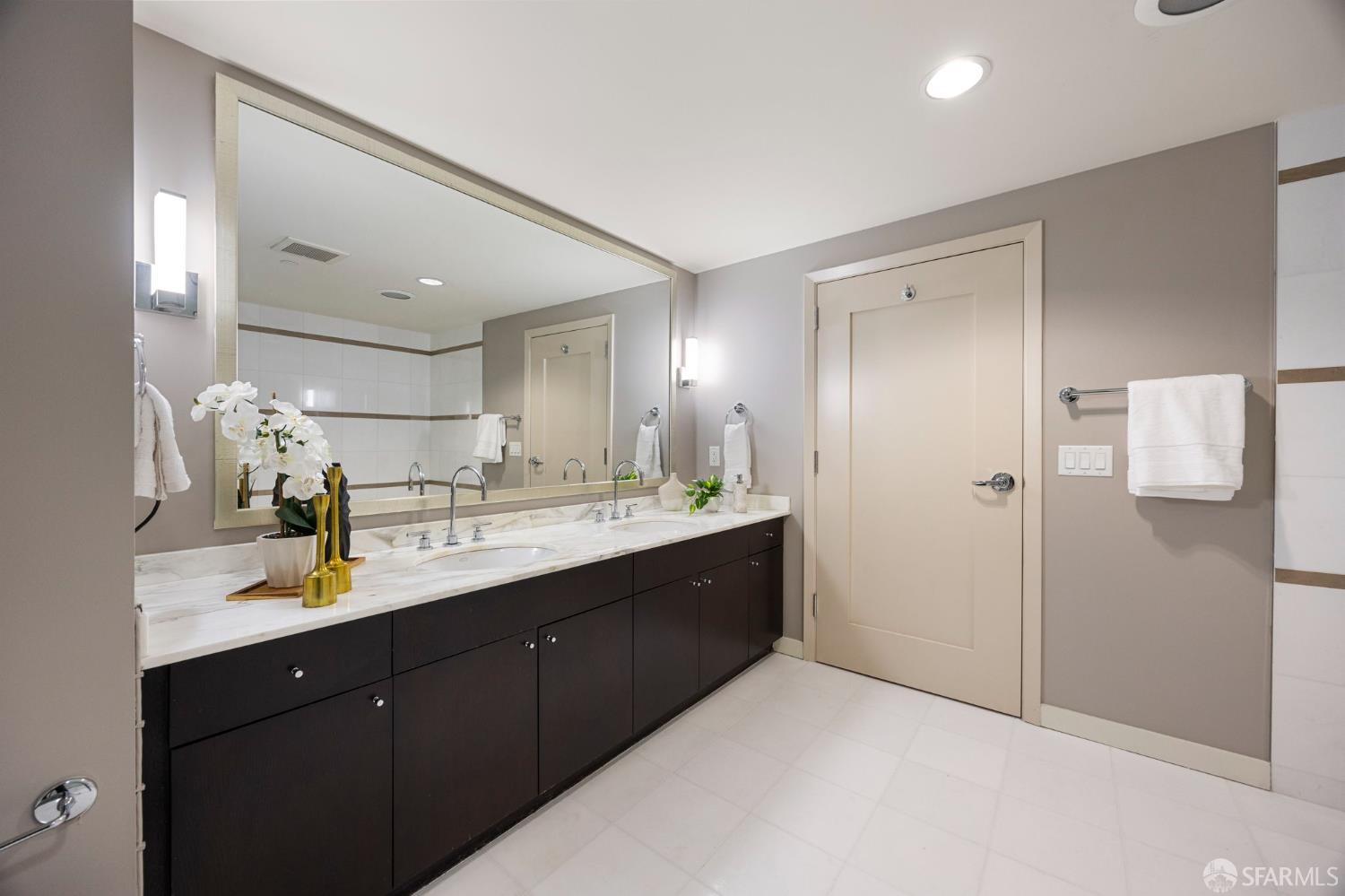 355 1st Street, Unit S2503 San Francisco, CA 94105 - Photo 29 of 67 a bathroom with a double vanity sink mirror and double