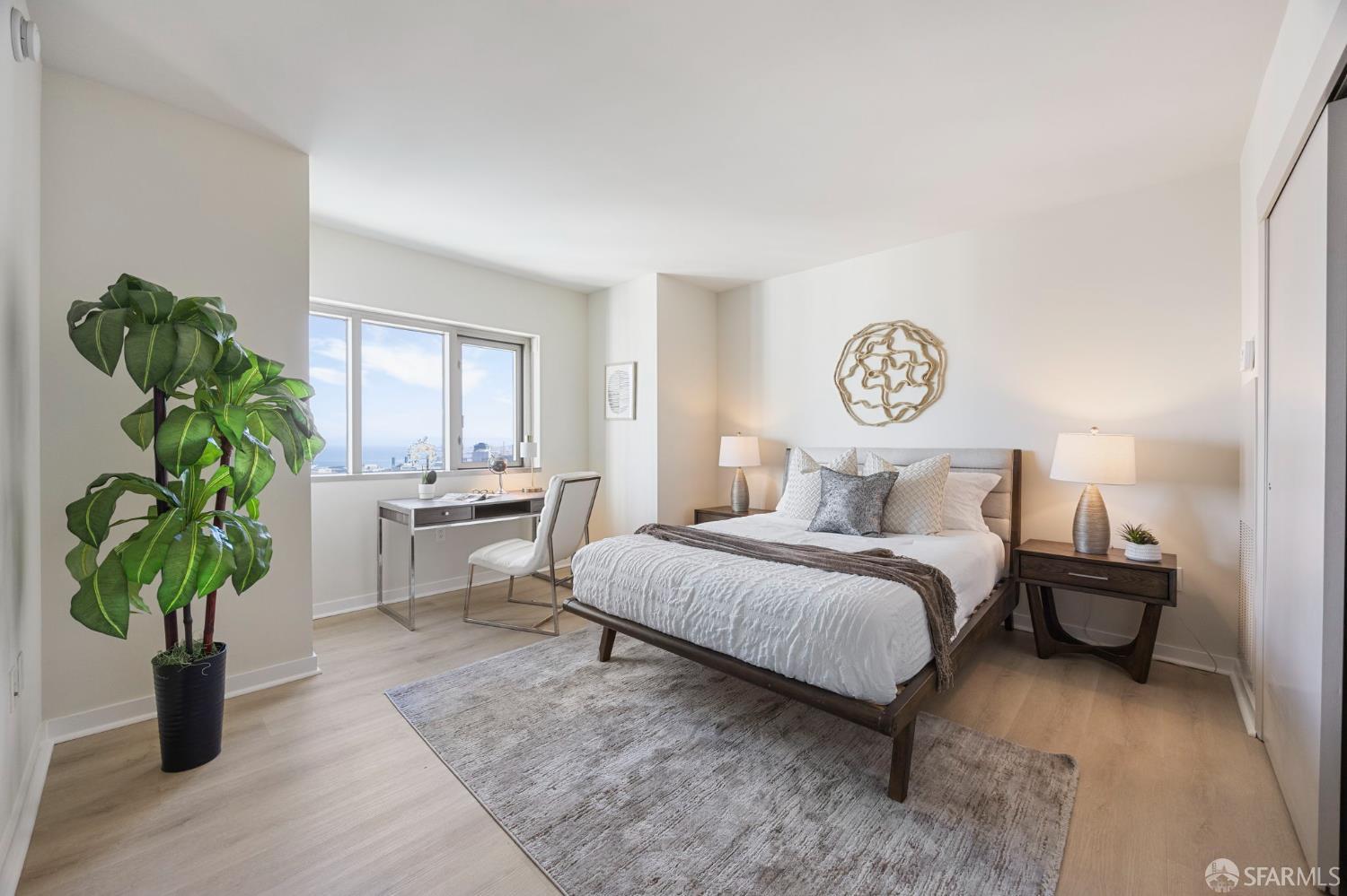 355 1st Street, Unit S2503 San Francisco, CA 94105 - Photo 30 of 67 a bedroom with bed and a potted plant