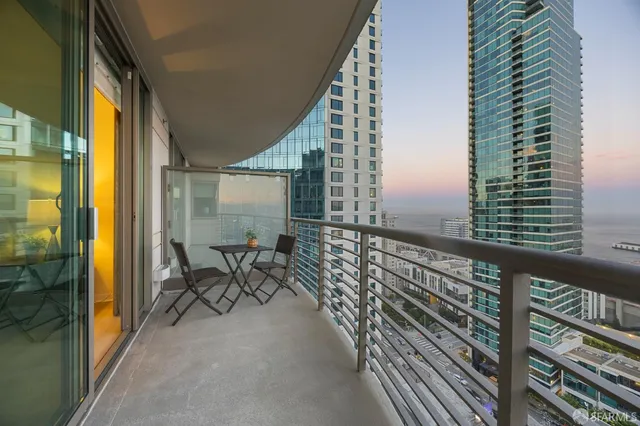 a view of a kitchen with dining table and chairs