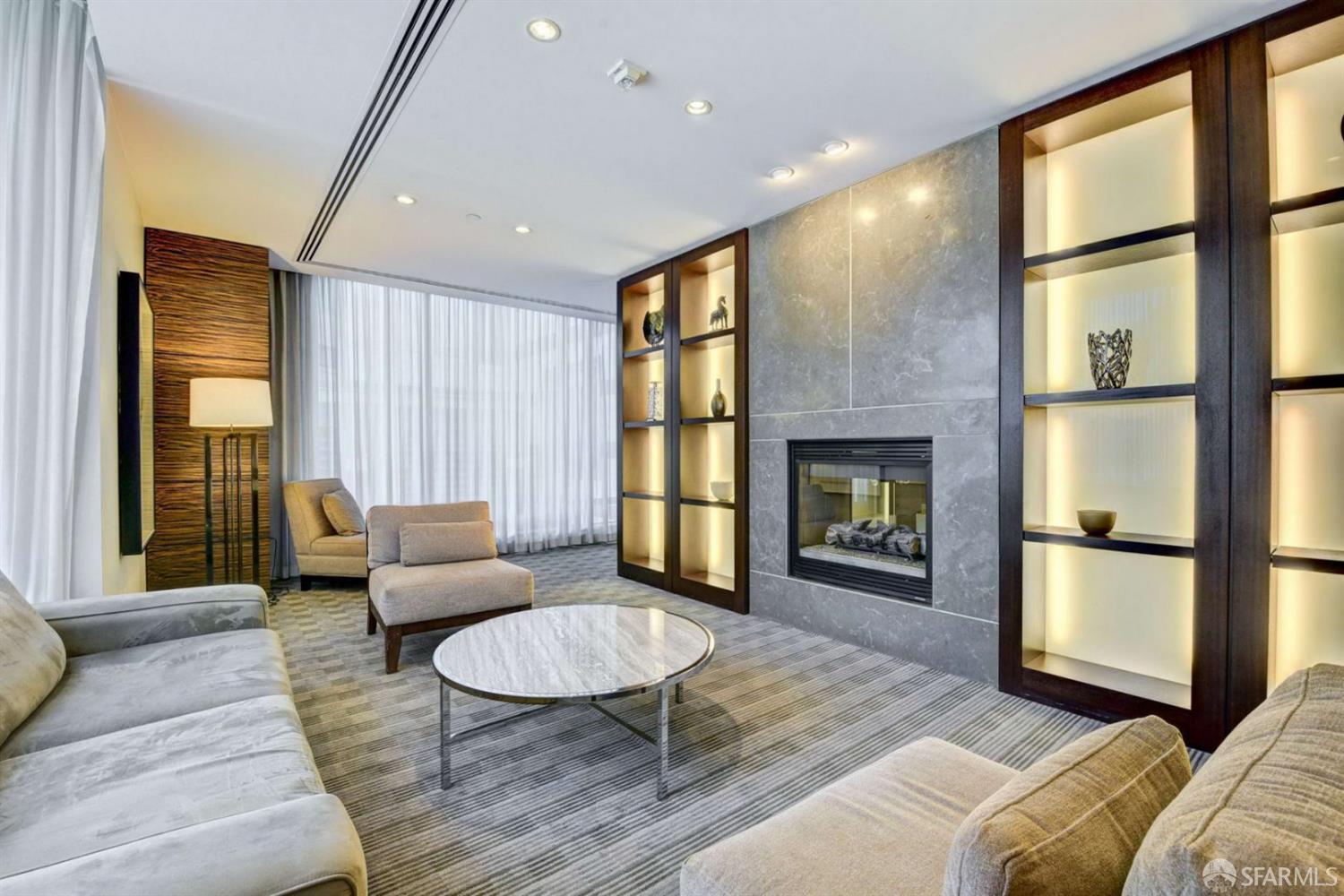 355 1st Street, Unit S2503 San Francisco, CA 94105 - Photo 46 of 67 a living room with furniture and a fireplace