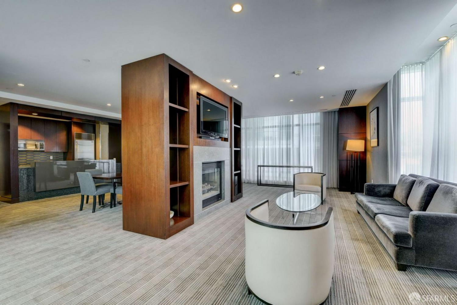 355 1st Street, Unit S2503 San Francisco, CA 94105 - Photo 47 of 67 a living room with furniture a dining table and kitchen view