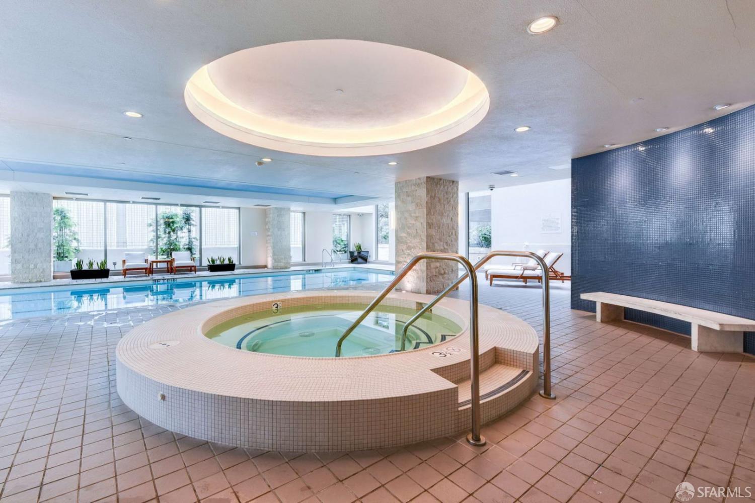 355 1st Street, Unit S2503 San Francisco, CA 94105 - Photo 48 of 67 a view of a swimming pool with a lounge chair