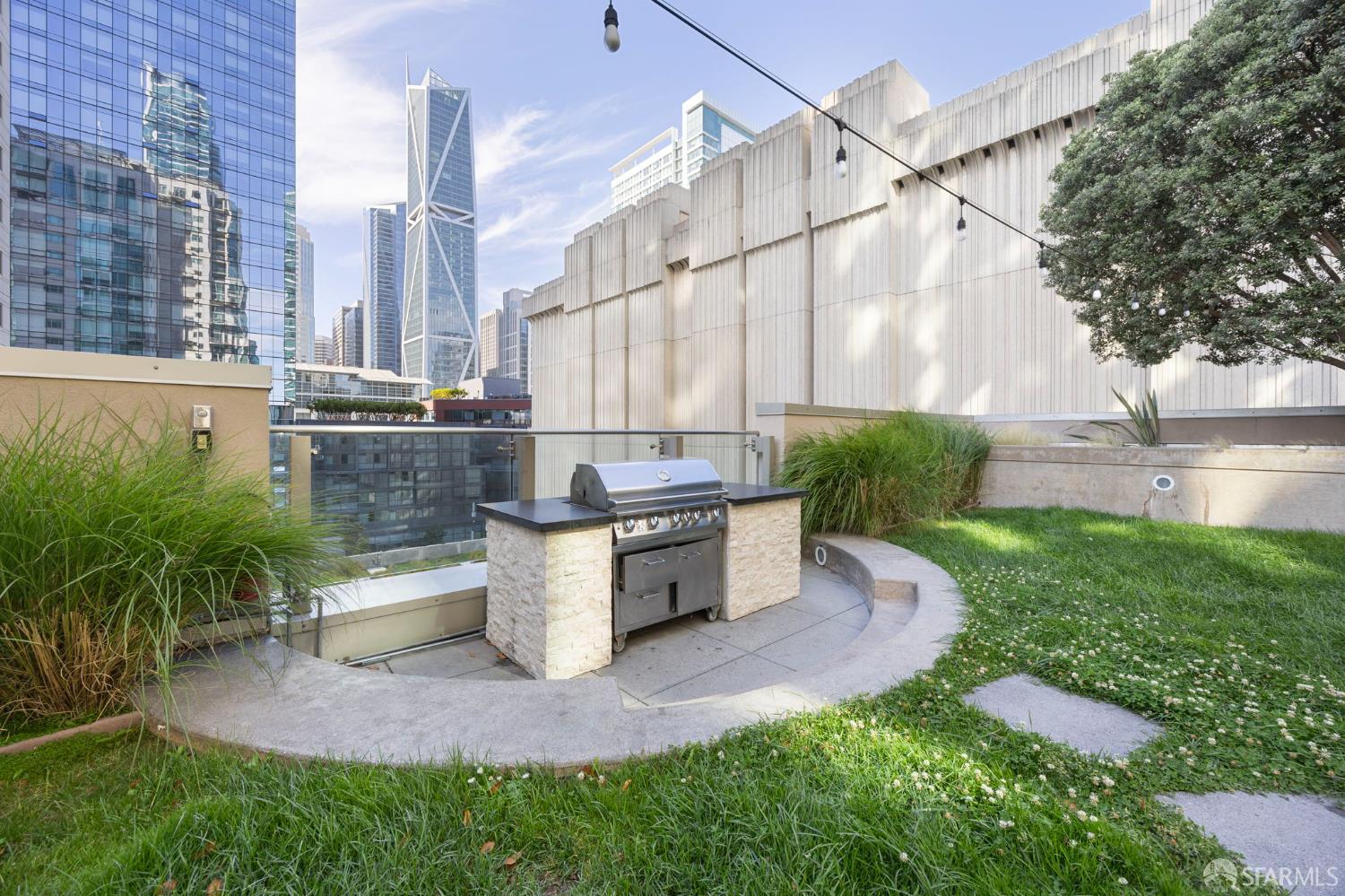 355 1st Street, Unit S2503 San Francisco, CA 94105 - Photo 55 of 67 a view of a back yard of the house with a fountain