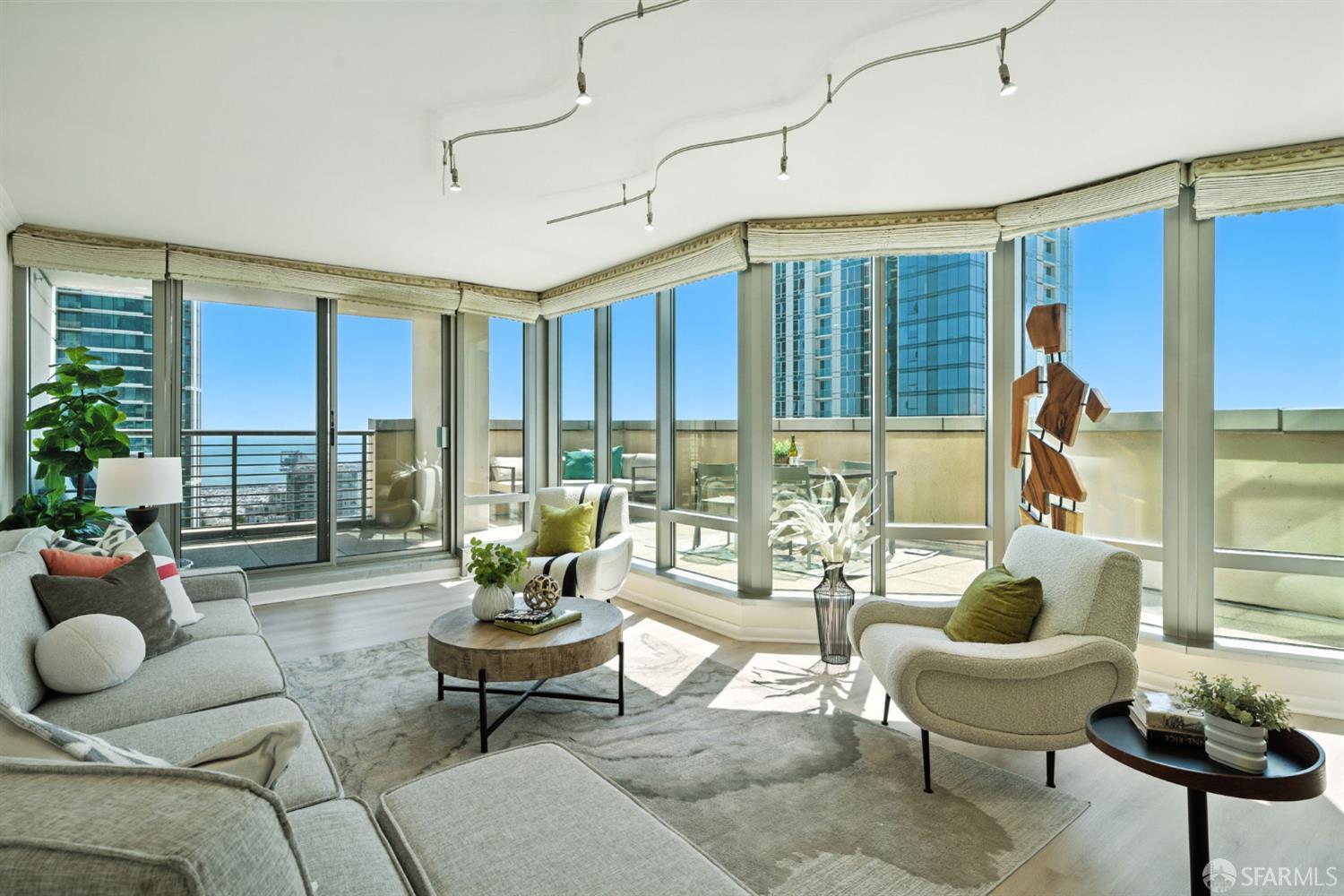 355 1st Street, Unit S2503 San Francisco, CA 94105 - Photo 7 of 67 a living room with furniture and floor to ceiling windows