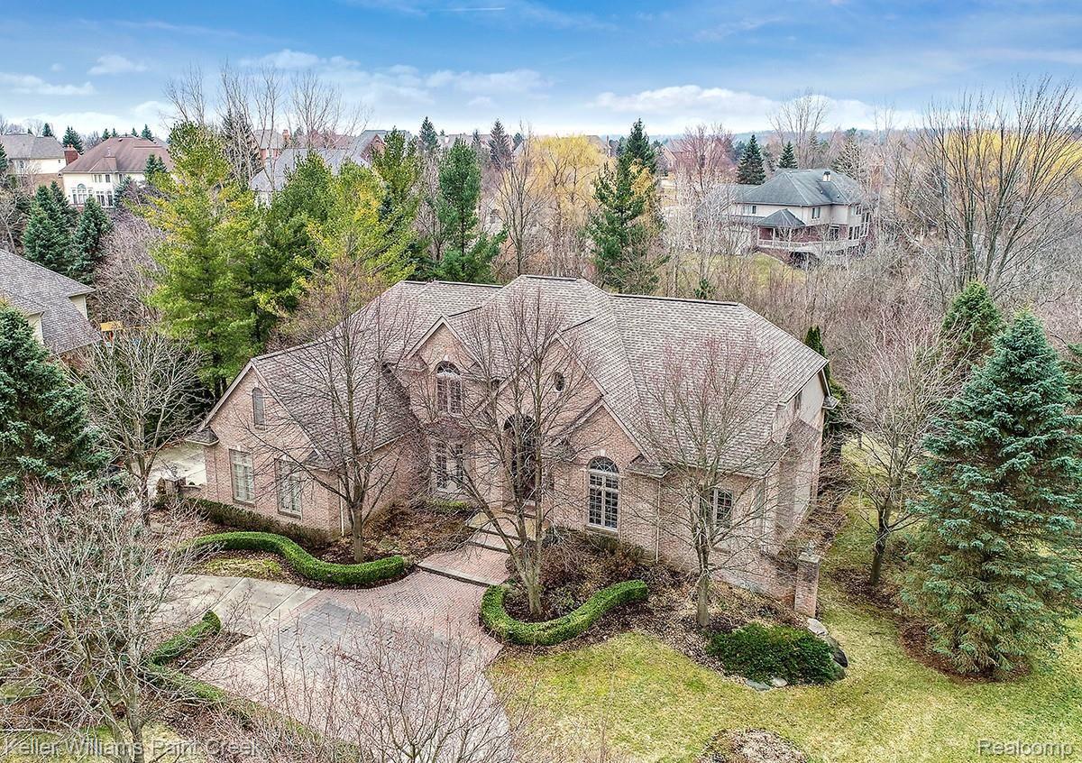 Mature landscaping surrounds the property