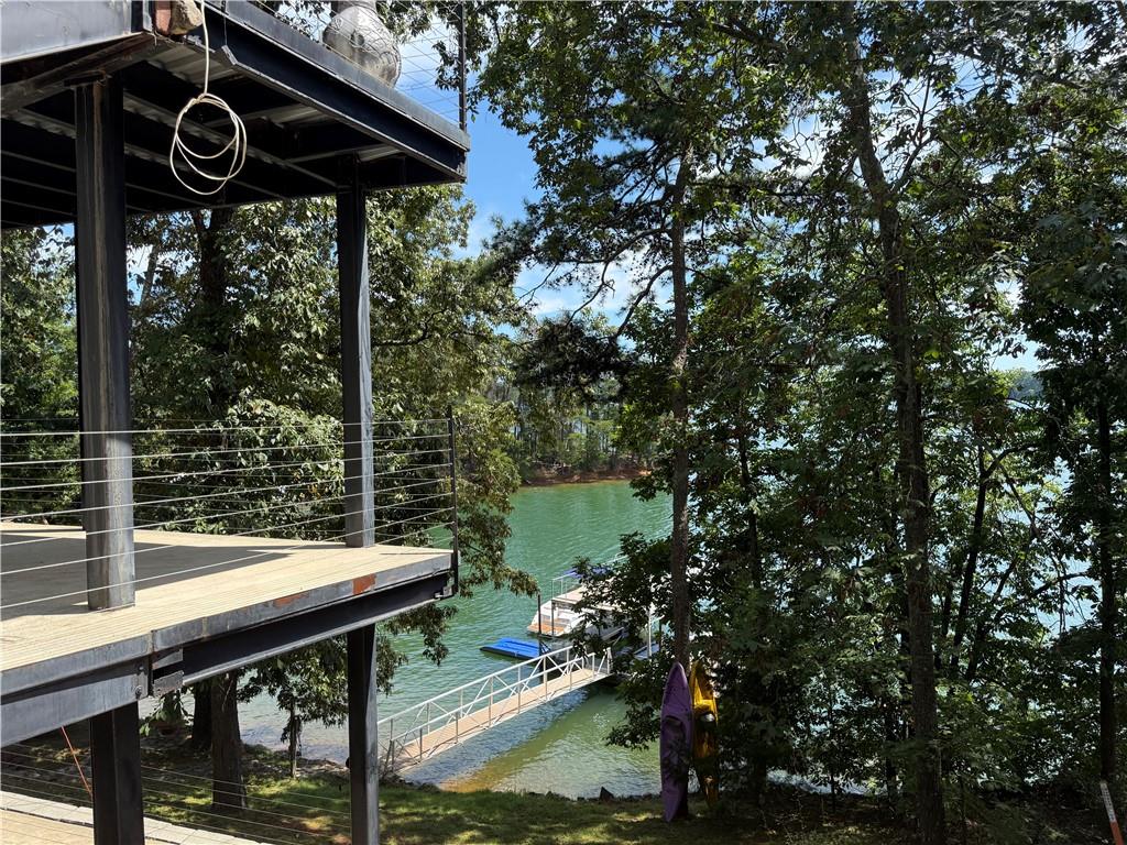 4265 Sinclair Shores Road Cumming, GA 30041 - Photo 11 of 18 a view of a chairs and table in a patio
