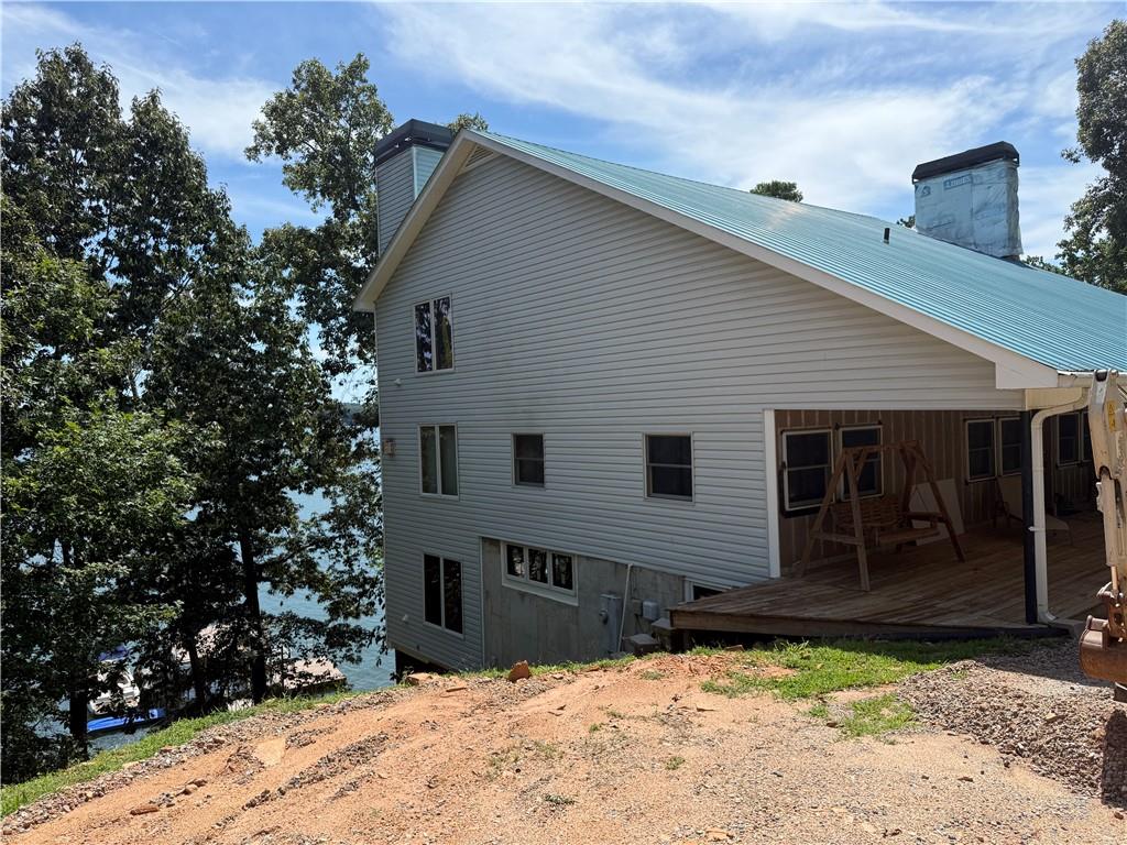 4265 Sinclair Shores Road Cumming, GA 30041 - Photo 16 of 18 a front view of a house with a yard