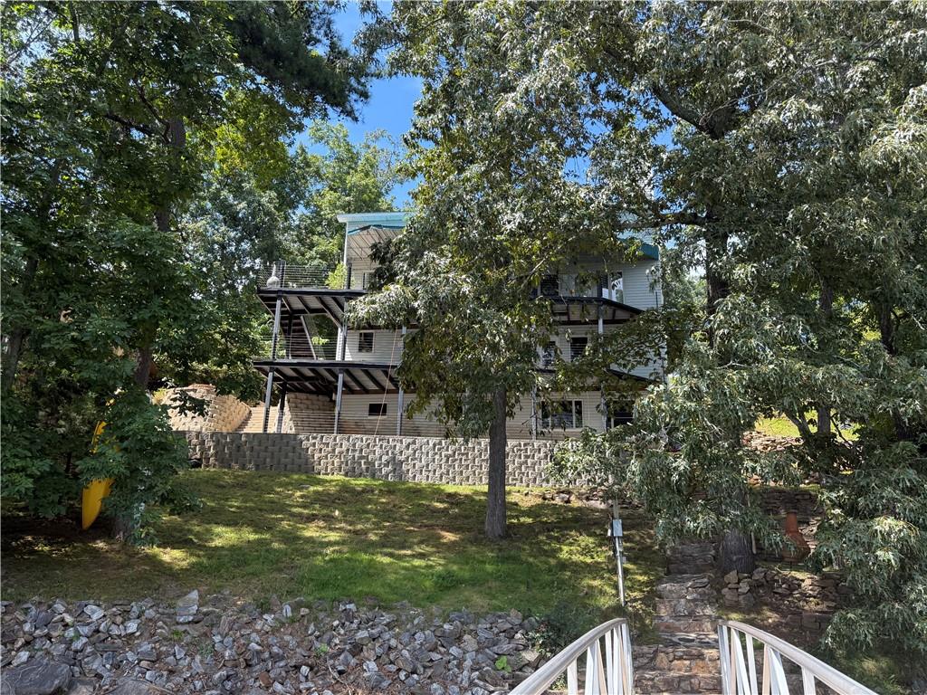 4265 Sinclair Shores Road Cumming, GA 30041 - Photo 4 of 18 a view of a house with a yard