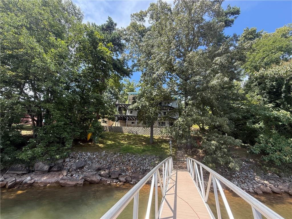 4265 Sinclair Shores Road Cumming, GA 30041 - Photo 5 of 18 a view of swimming pool from a balcony