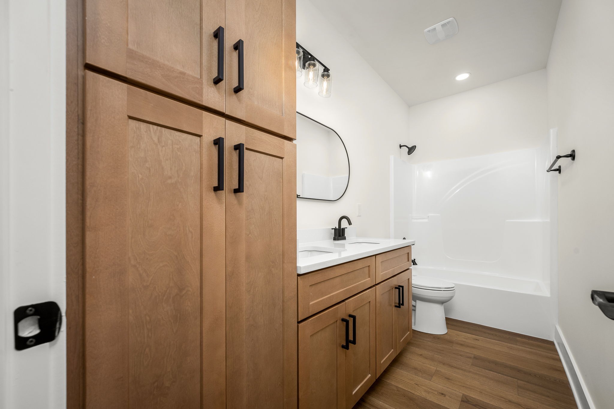4151 Asbury Road Manchester, TN 37355 - Photo 25 of 32 a bathroom with a double vanity sink toilet and shower