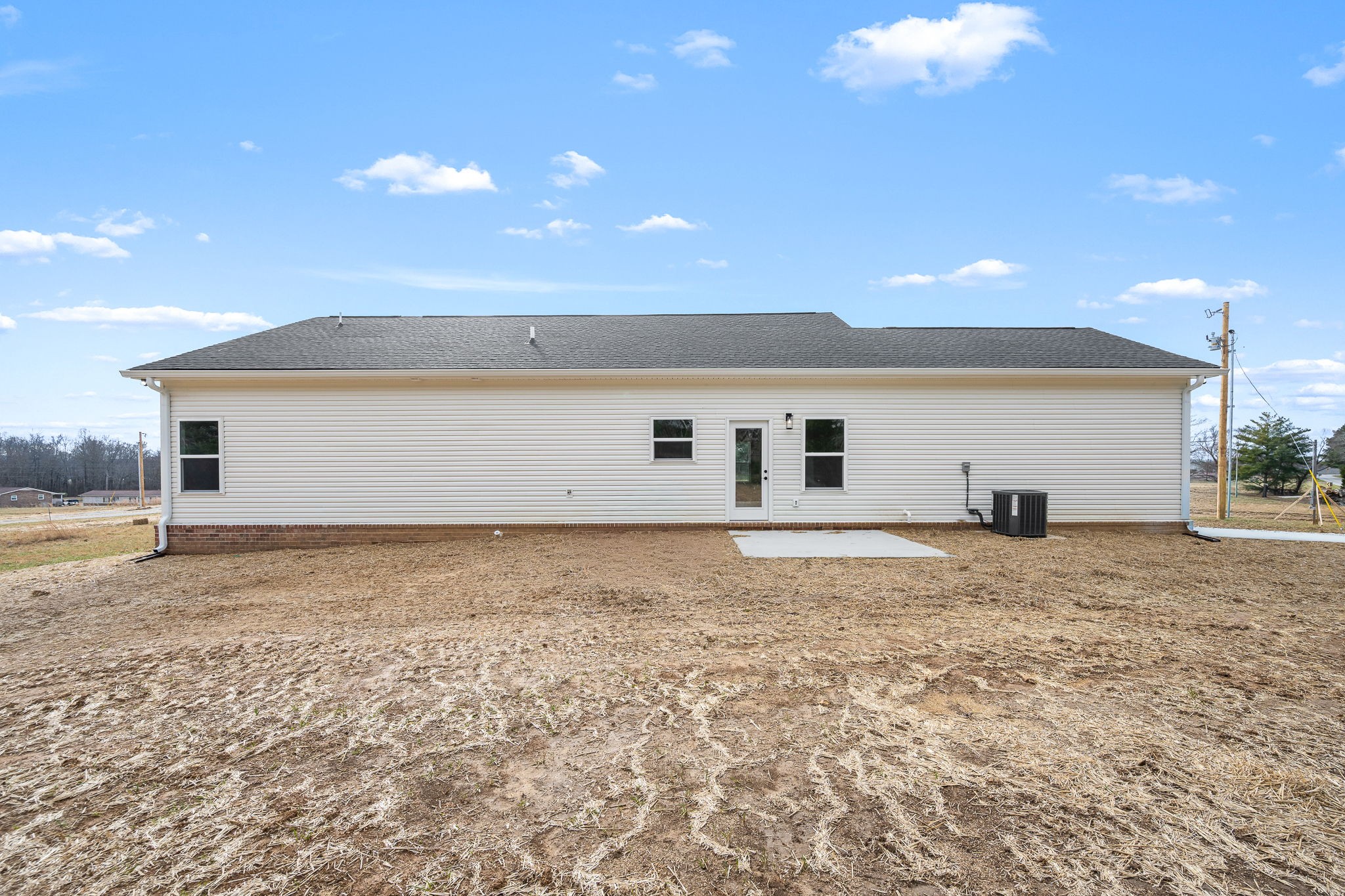 4151 Asbury Road Manchester, TN 37355 - Photo 30 of 32 a view of backyard of house and car parked