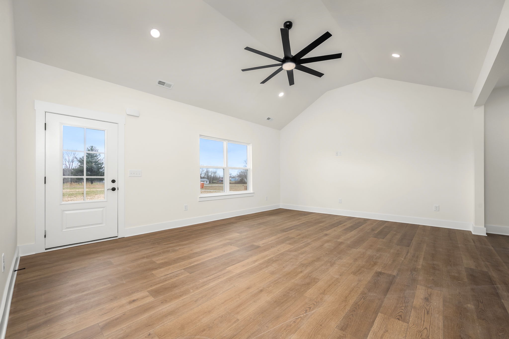 4151 Asbury Road Manchester, TN 37355 - Photo 7 of 32 wooden floor in an empty room with a window