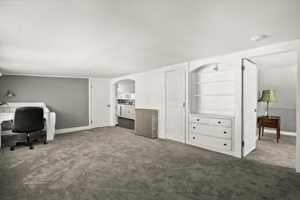 1 Elm Street, Unit 3 Freetown, MA 02702 - Photo 11 of 16 a view of a bedroom with cabinet mirror and windows