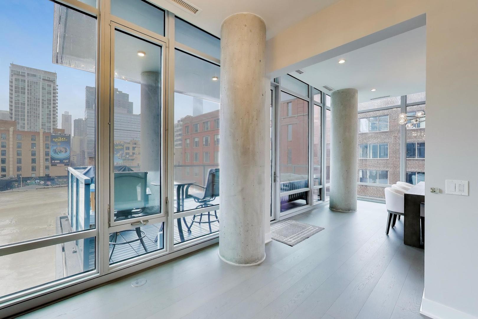 360 West Erie Street, Unit 5D Chicago, IL 60654 - Photo 11 of 41 a room with lots of table and chairs