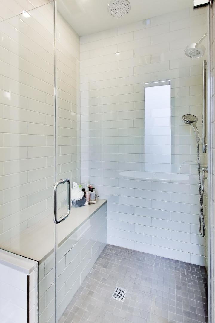 360 West Erie Street, Unit 5D Chicago, IL 60654 - Photo 20 of 41 a bathroom with a sink and a shower