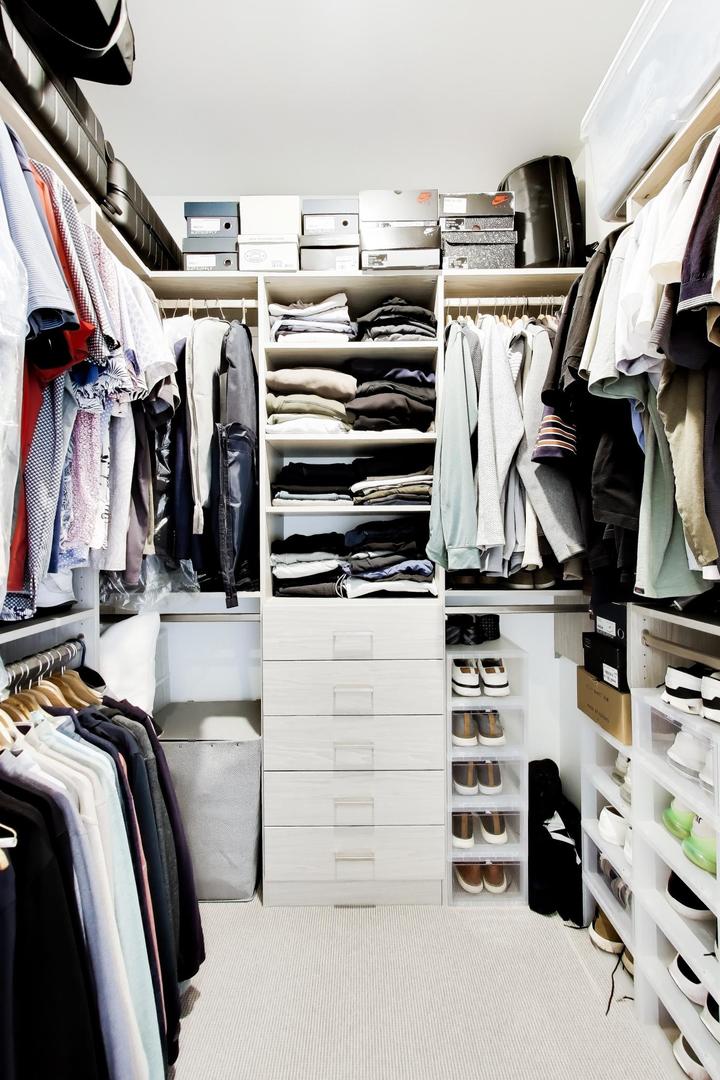 360 West Erie Street, Unit 5D Chicago, IL 60654 - Photo 22 of 41 a view of walk in closet with clothes and shoes