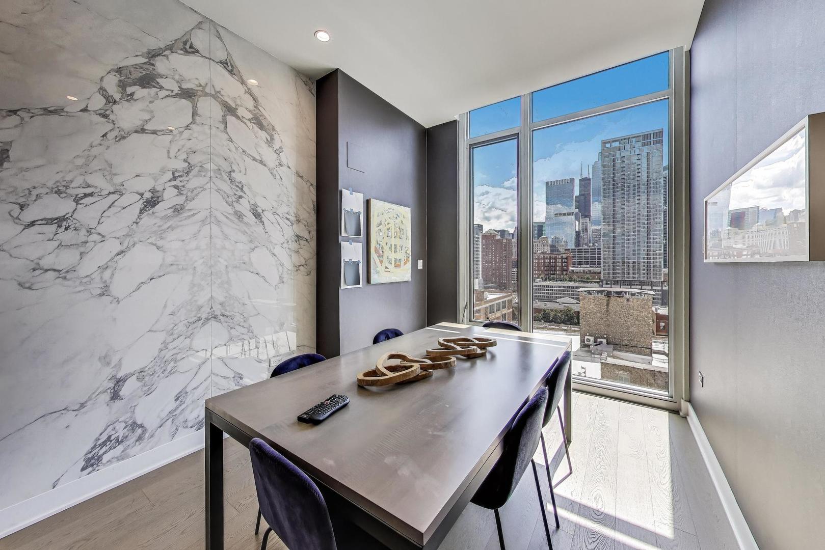 360 West Erie Street, Unit 5D Chicago, IL 60654 - Photo 39 of 41 a view of a dining room with furniture and window
