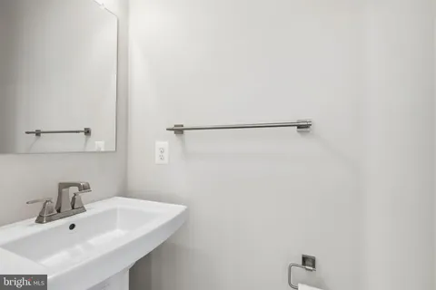 a bathroom with a sink and mirror