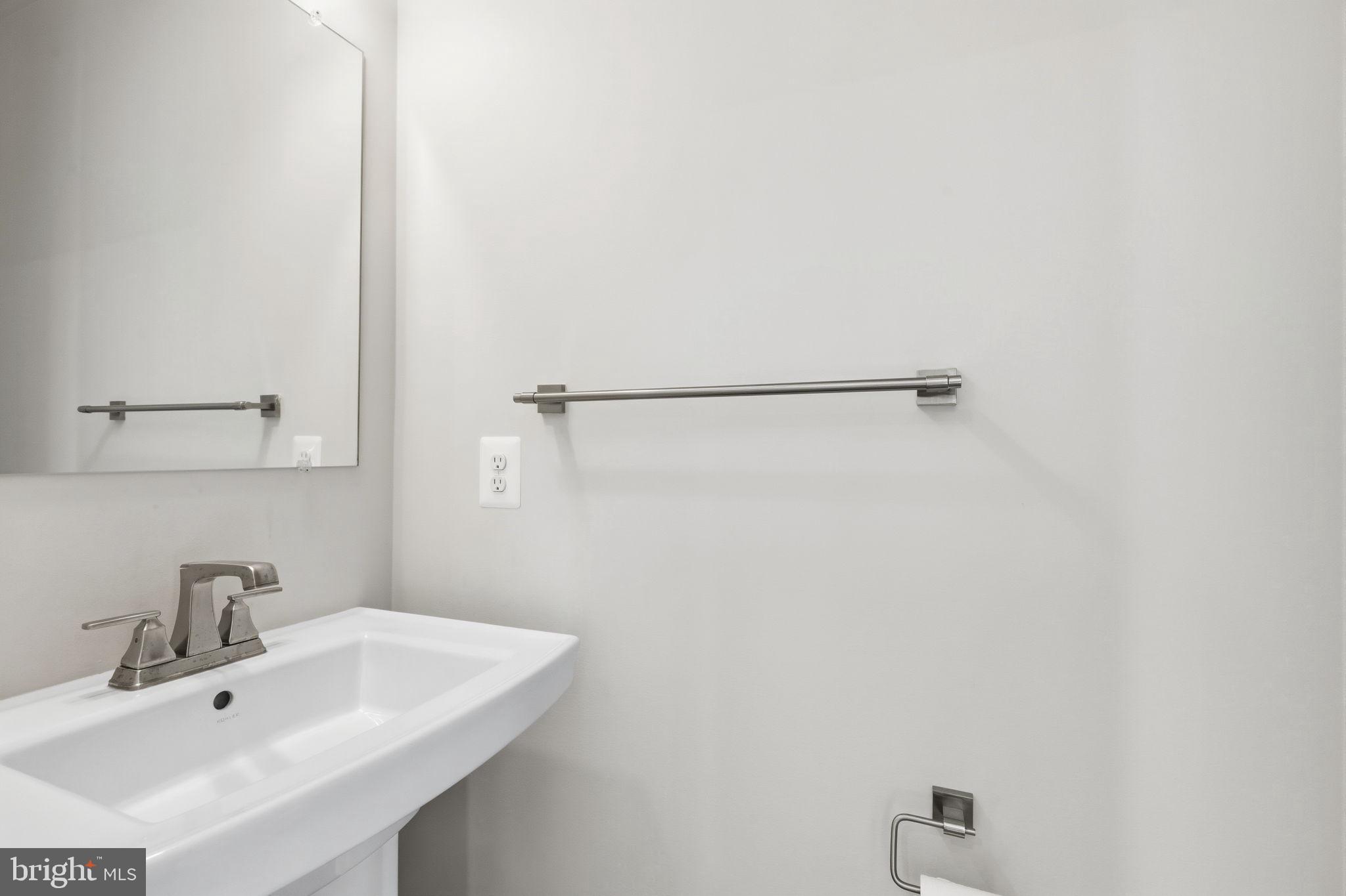 1566 Lowman Street Baltimore, MD 21230 - Photo 12 of 47 a bathroom with a sink and mirror