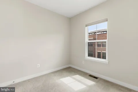 a view of a hallway with closet and closet area