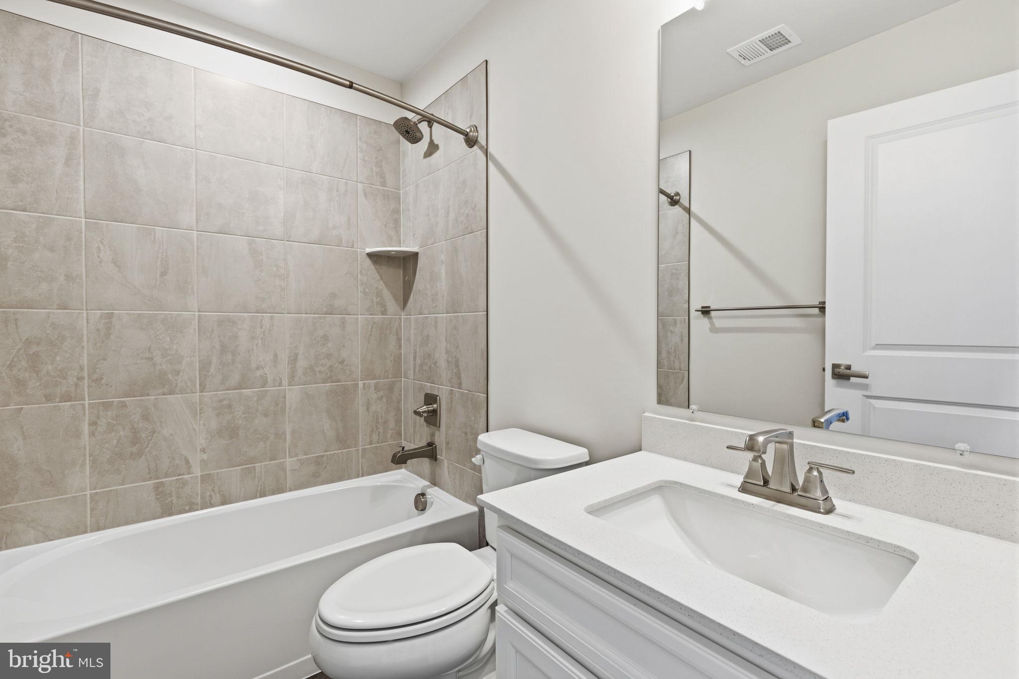 1566 Lowman Street Baltimore, MD 21230 - Photo 28 of 47 a bathroom with a sink a toilet and a bathtub