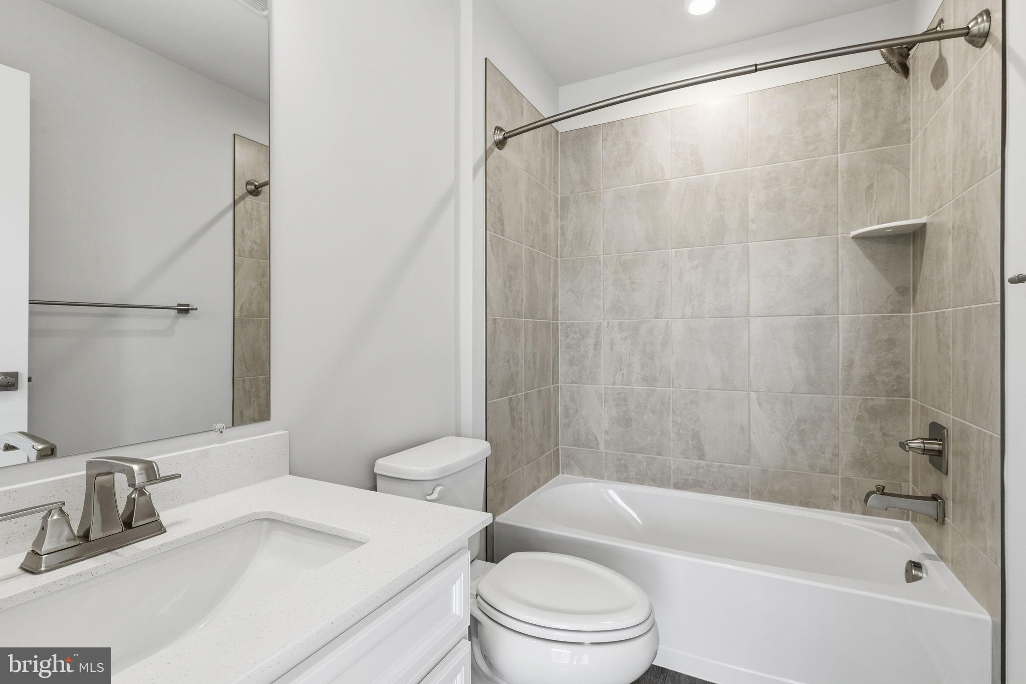 1566 Lowman Street Baltimore, MD 21230 - Photo 33 of 47 a bathroom with a sink toilet and shower