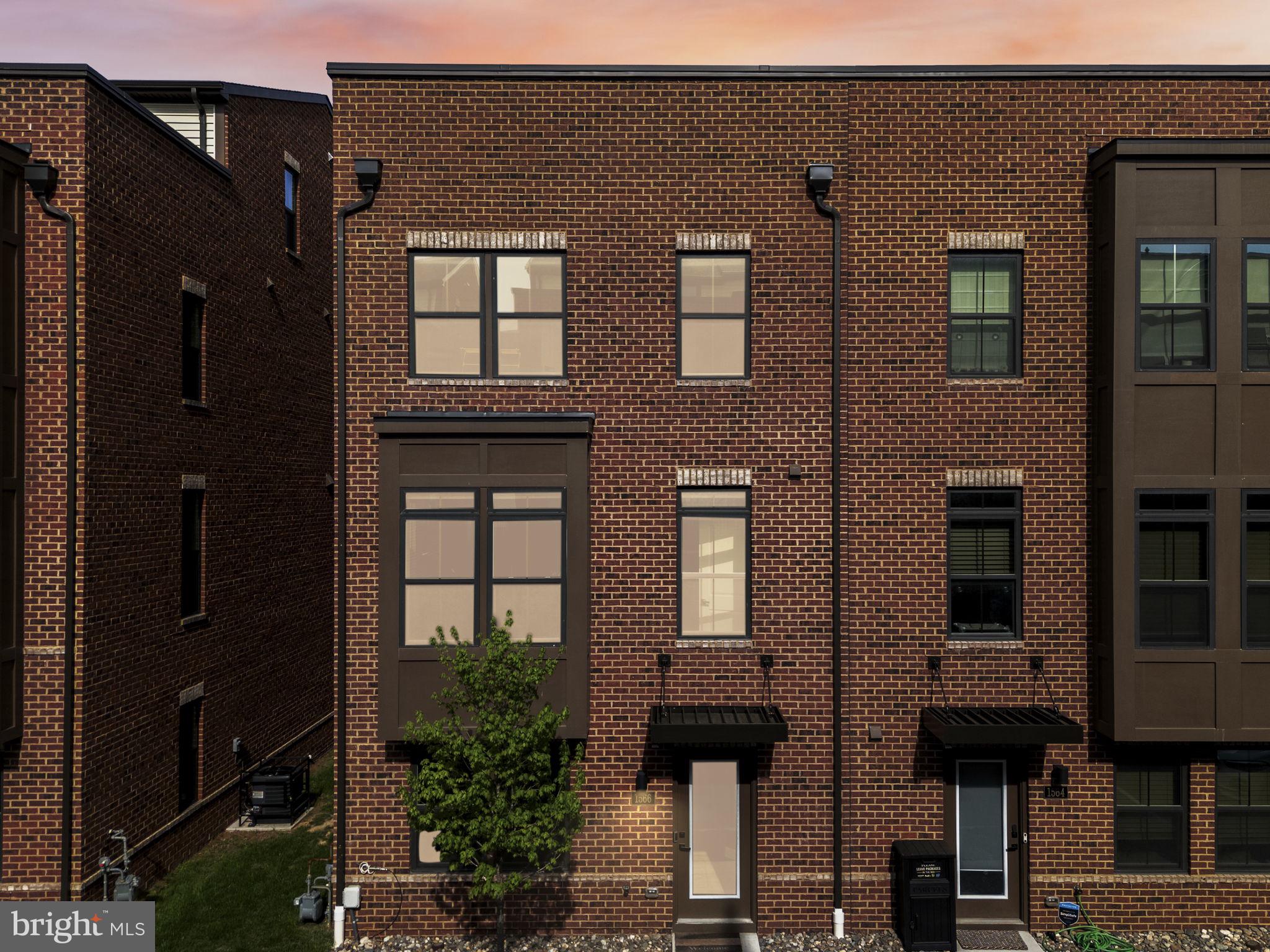 1566 Lowman Street Baltimore, MD 21230 - Photo 42 of 47 a front view of a house with many windows