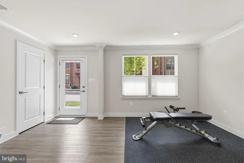 a room with gym equipment and a window