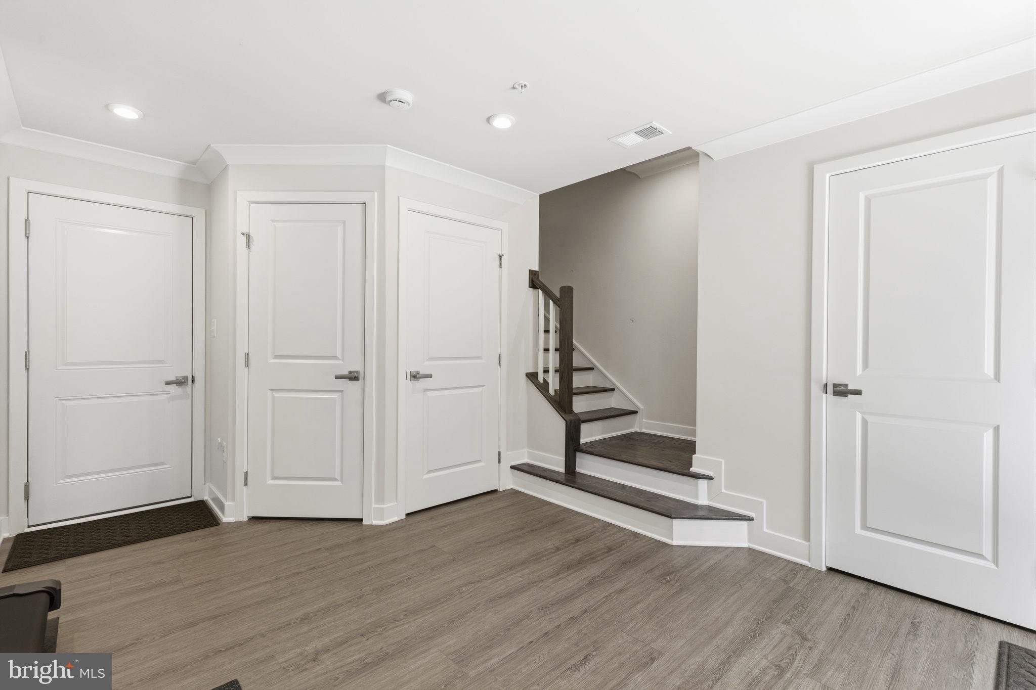 1566 Lowman Street Baltimore, MD 21230 - Photo 8 of 47 a view of an empty room with wooden floor and closet area